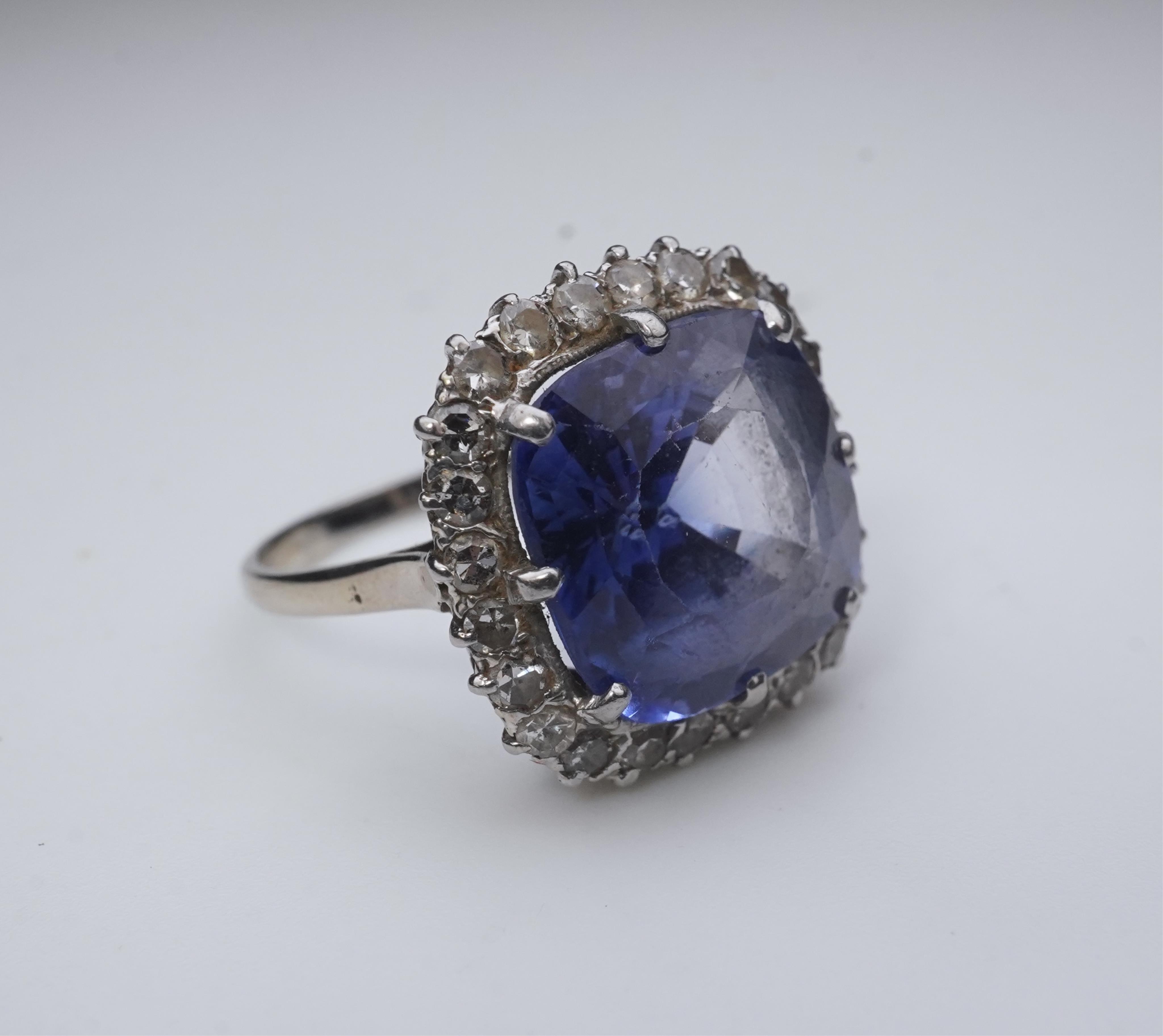 A synthetic sapphire and diamond cluster ring, early 20th century